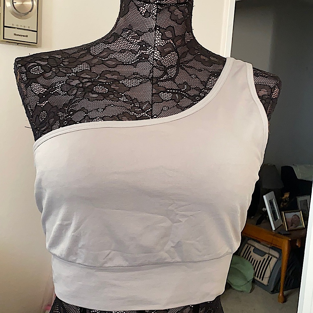 Pink seamless one shoulder sports bra.